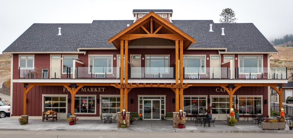 a large building with a balcony on the front of it at Hillcrest Farm Market B&B in Kelowna