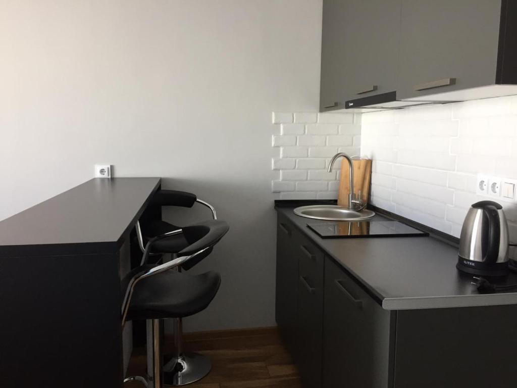 Kuchyň nebo kuchyňský kout v ubytování SkiLuxe New Gudauri - Loft 2