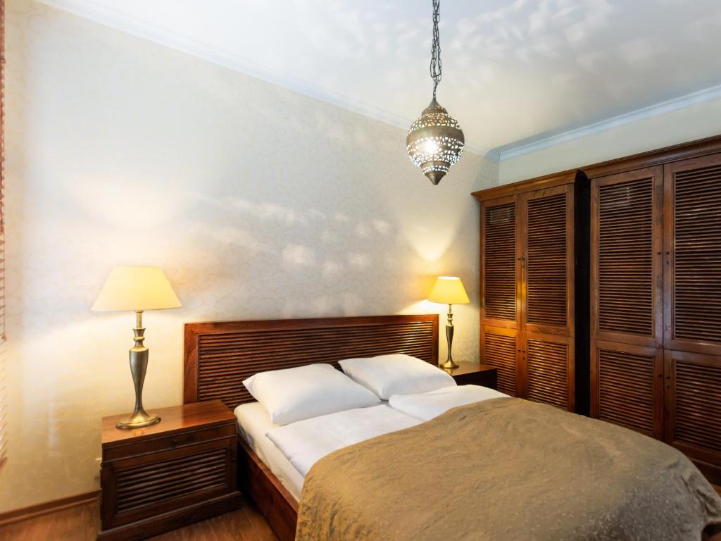 Postel nebo postele na pokoji v ubytování VacationClub – Olympic Park Apartament B8