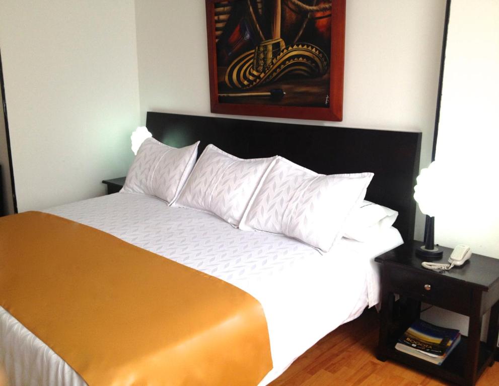 Postel nebo postele na pokoji v ubytování Hotel Ferrovial Corferias