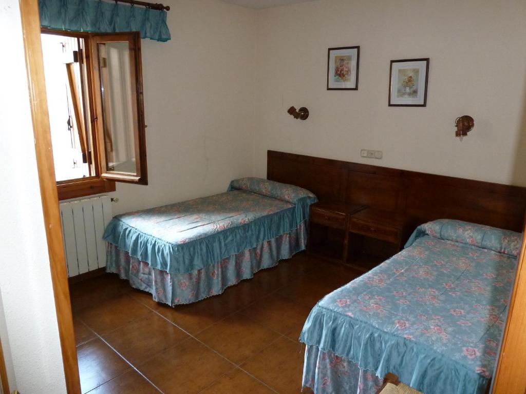 Postel nebo postele na pokoji v ubytování Apartahotel Faure