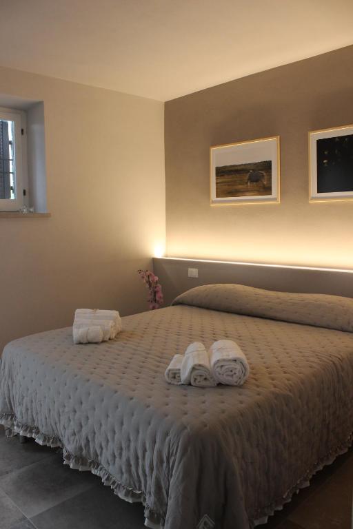 A bed or beds in a room at Agriturismo Qui e Ora