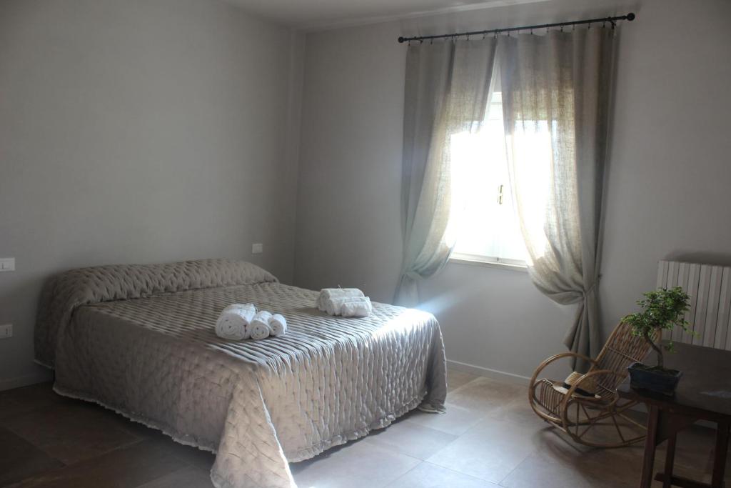 A bed or beds in a room at Agriturismo Qui e Ora