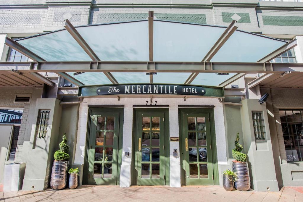 a building with a sign that reads the mercantile hotel at The Mercantile Hotel in New Orleans