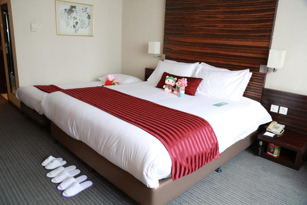 Postel nebo postele na pokoji v ubytování Jinglun Hotel Beijing