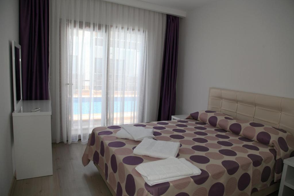 Postel nebo postele na pokoji v ubytování Siesta Garden Apart Hotel