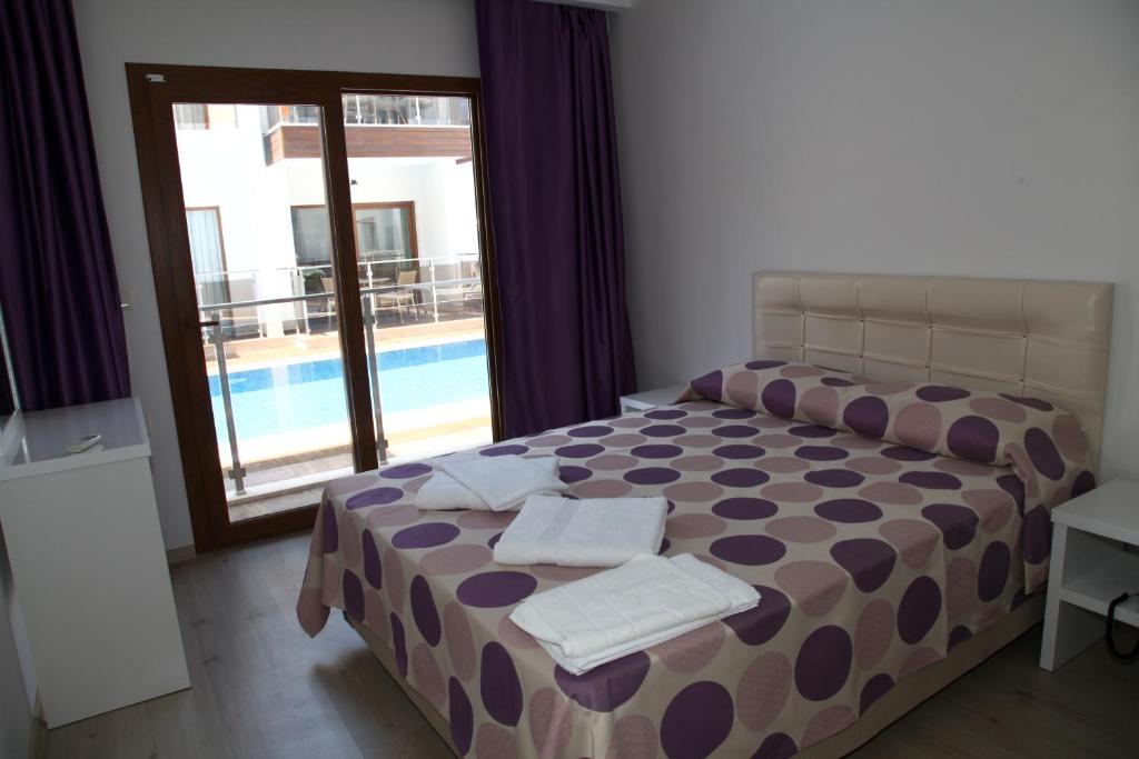 Postel nebo postele na pokoji v ubytování Siesta Garden Apart Hotel