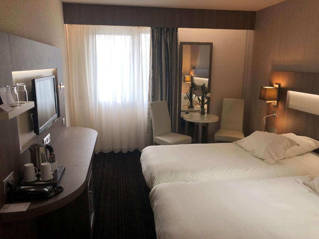 Postel nebo postele na pokoji v ubytování Best Western Marseille Aeroport