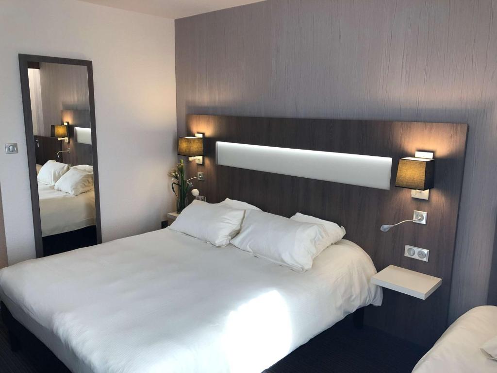 Postel nebo postele na pokoji v ubytování Best Western Marseille Aeroport