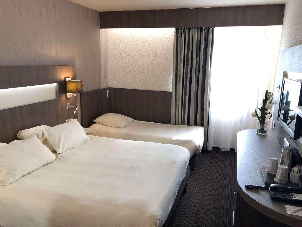 Postel nebo postele na pokoji v ubytování Best Western Marseille Aeroport