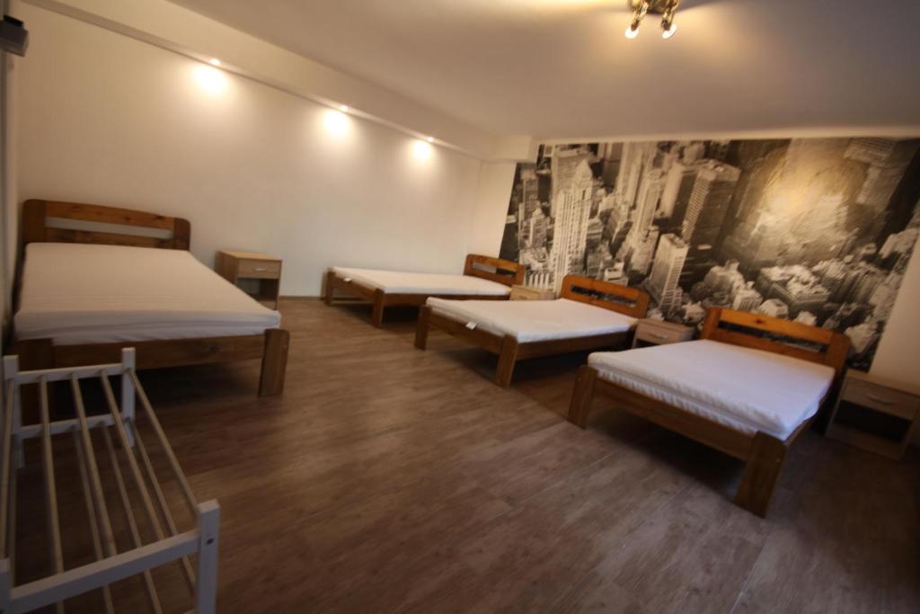 A bed or beds in a room at Wigury Stay