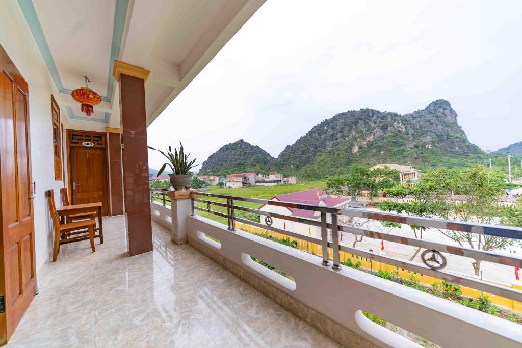 a balcony with a view of the mountains at An Binh Homestay in Phong Nha