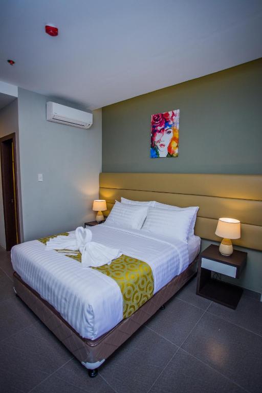 Postel nebo postele na pokoji v ubytování Hotel Costa Brava