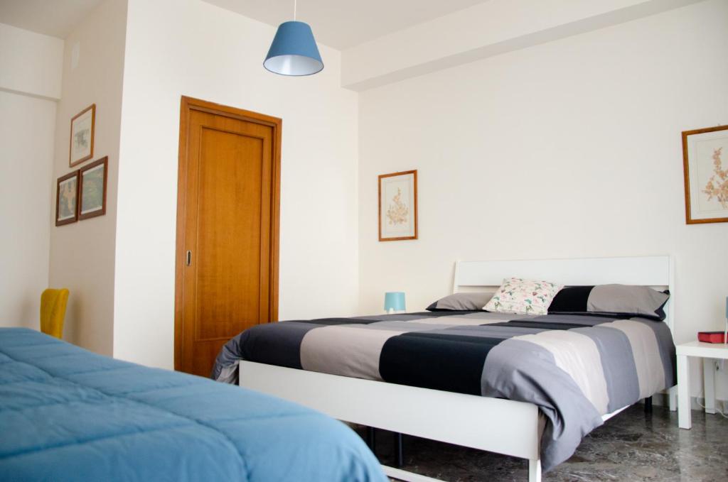 Postel nebo postele na pokoji v ubytování Casa Gentile Carducci
