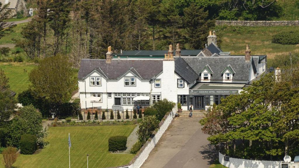 an aerial view of a large white house at Scourie Hotel in Scourie