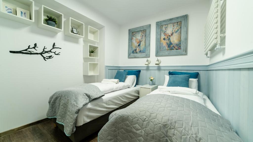 Posteľ alebo postele v izbe v ubytovaní Apartamenty Sun & Snow Sarnia Residence