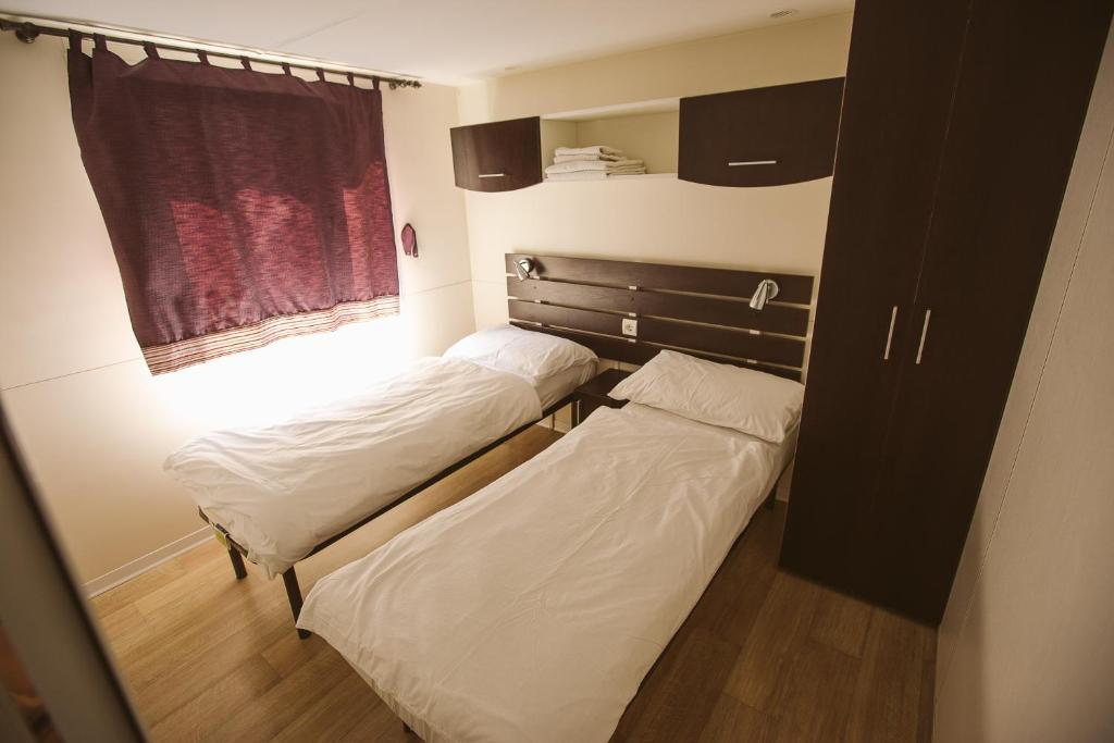 Postel nebo postele na pokoji v ubytování Mobile homes Marita