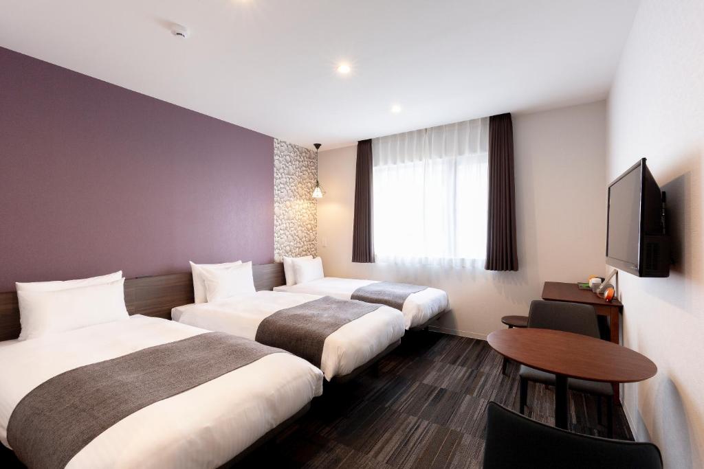 Postel nebo postele na pokoji v ubytování M's Hotel Gojo Naginatagiri
