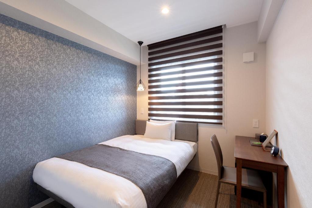 Postel nebo postele na pokoji v ubytování M's Hotel Gojo Naginatagiri