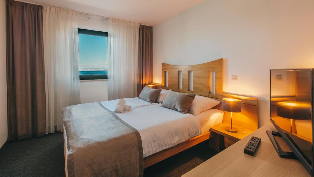 Postel nebo postele na pokoji v ubytování Veya Maradiso Hotel by Aminess
