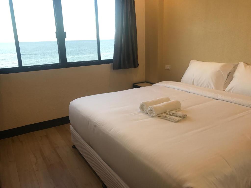 Postel nebo postele na pokoji v ubytování Babylon Oslob Coast Guesthouse