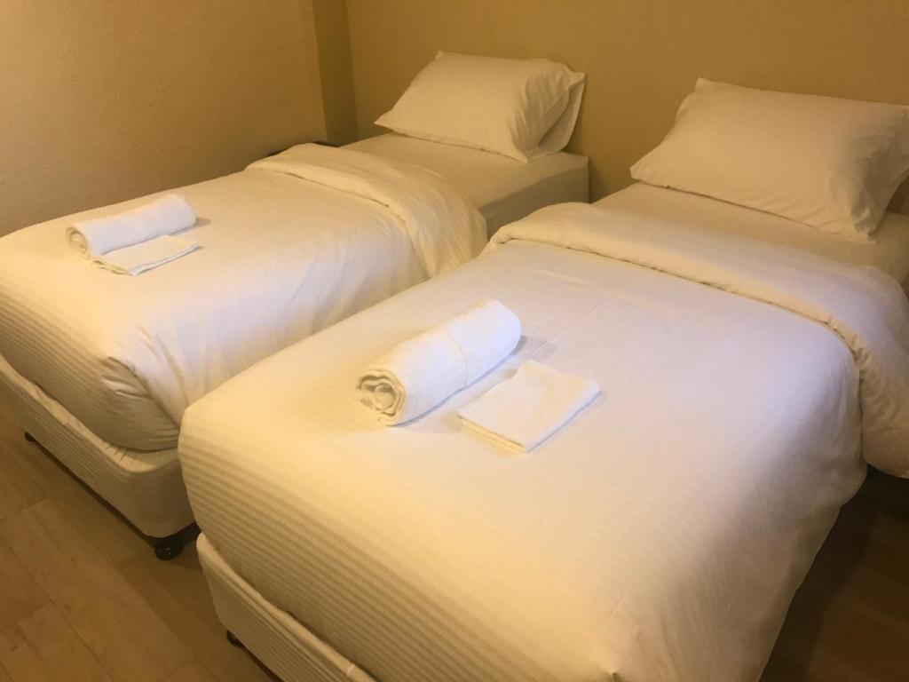 Postel nebo postele na pokoji v ubytování Babylon Oslob Coast Guesthouse