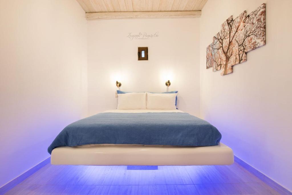 Postel nebo postele na pokoji v ubytování Anemolia Villa