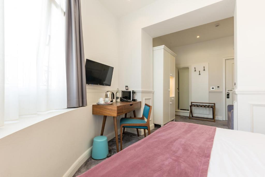 Ένα ή περισσότερα κρεβάτια σε δωμάτιο στο Public House Hotel