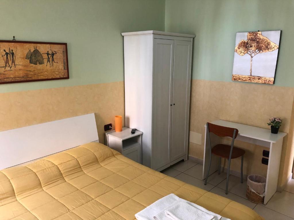 Postel nebo postele na pokoji v ubytování B&B Quattro Palazzi Napoli Centro