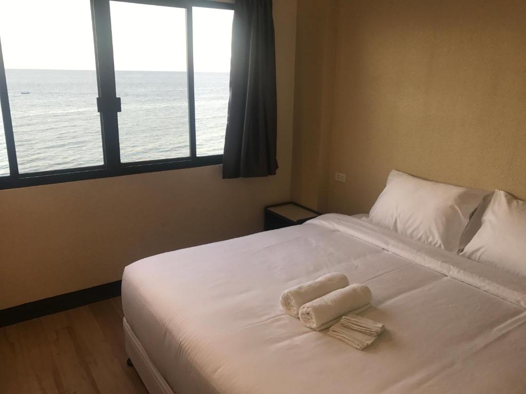 Postel nebo postele na pokoji v ubytování Babylon Oslob Coast Guesthouse