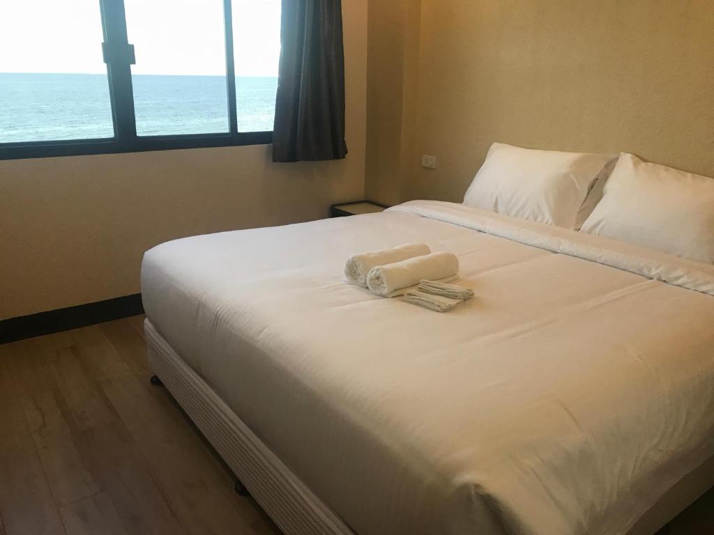 Postel nebo postele na pokoji v ubytování Babylon Oslob Coast Guesthouse