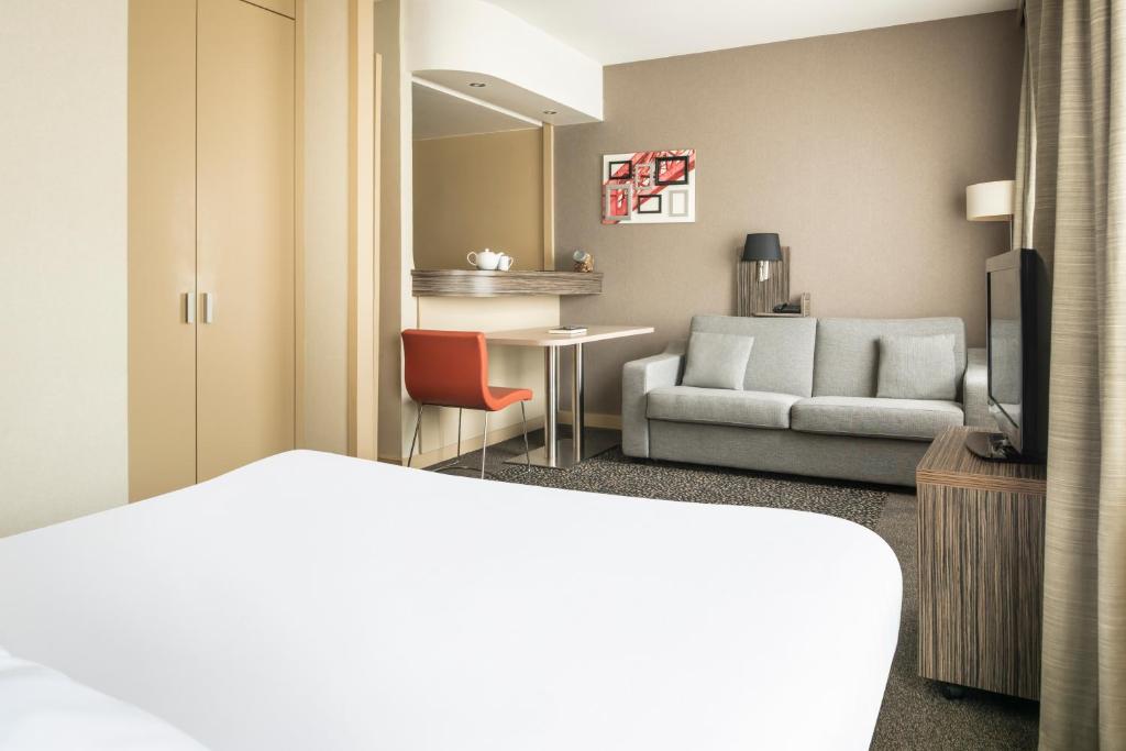 Postel nebo postele na pokoji v ubytování Aparthotel Adagio La Défense Esplanade