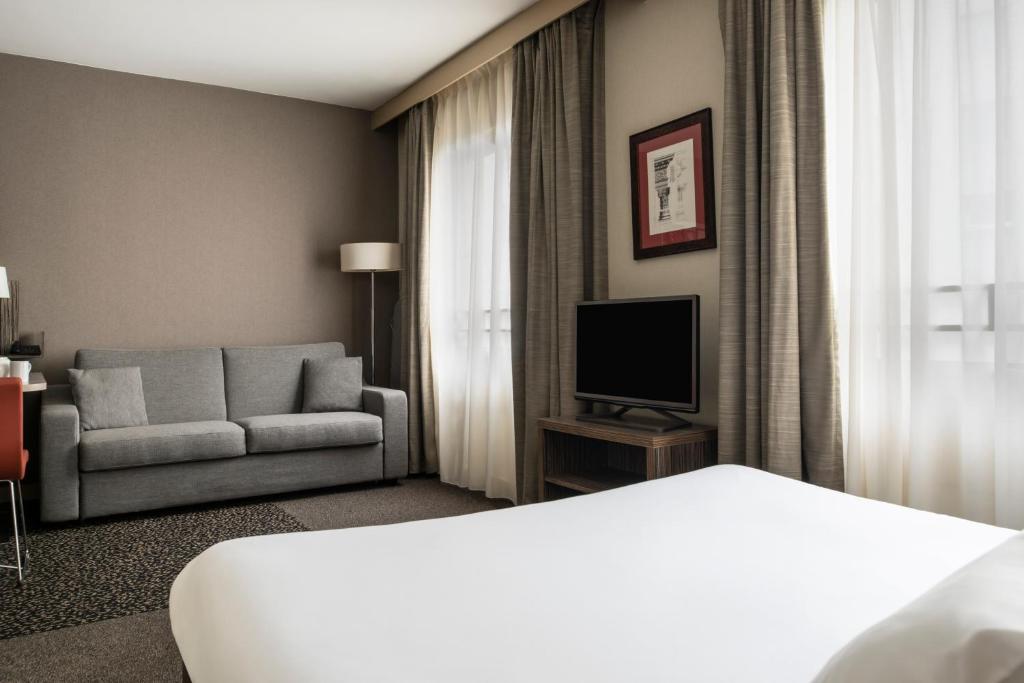 TV a/nebo společenská místnost v ubytování Aparthotel Adagio La Défense Esplanade