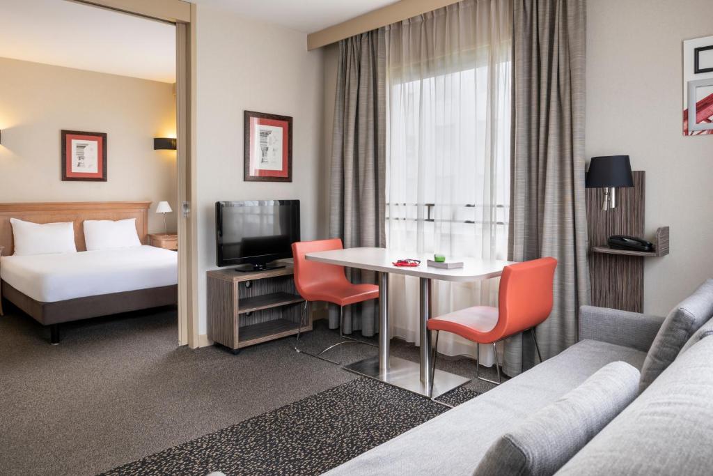 Postel nebo postele na pokoji v ubytování Aparthotel Adagio La Défense Esplanade