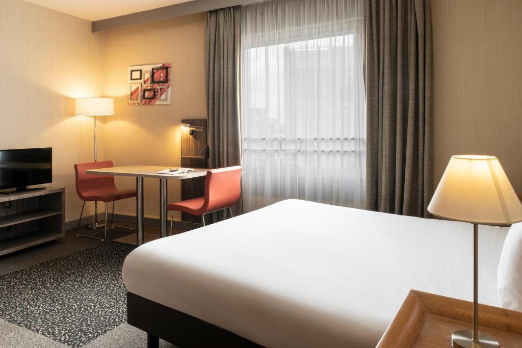 TV a/nebo společenská místnost v ubytování Aparthotel Adagio La Défense Esplanade