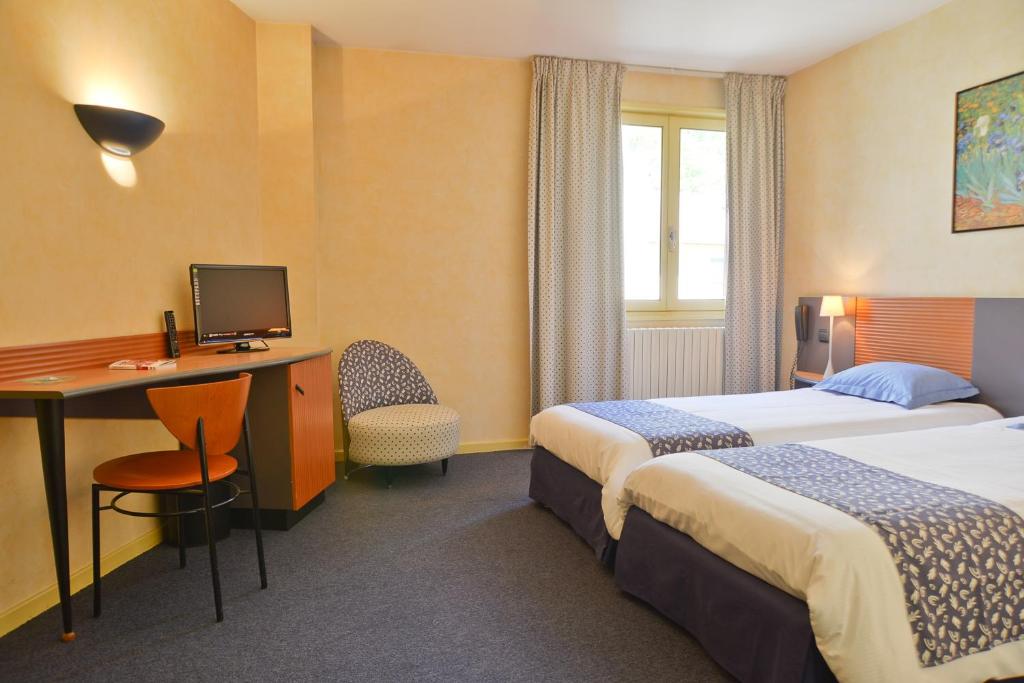 מיטה או מיטות בחדר ב-Hotel Restaurant Rolland