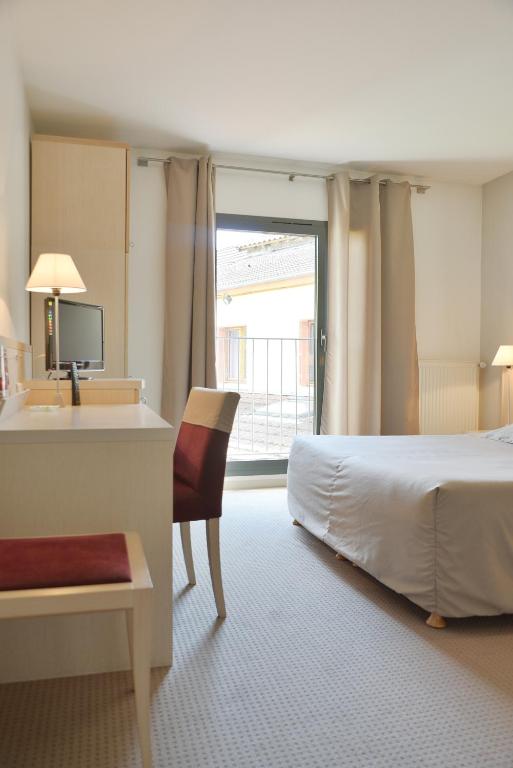 Postel nebo postele na pokoji v ubytování Hotel Restaurant Rolland