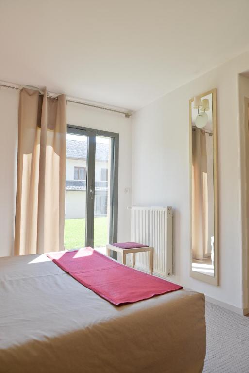Postel nebo postele na pokoji v ubytování Hotel Restaurant Rolland