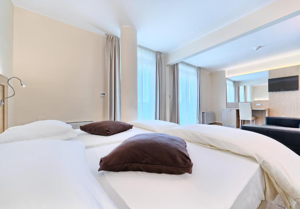 Postel nebo postele na pokoji v ubytování Hotel Panorama