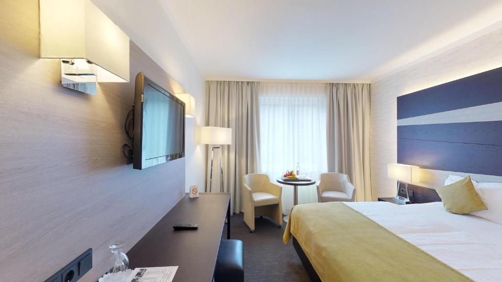 Postel nebo postele na pokoji v ubytování Parc Hotel Alvisse