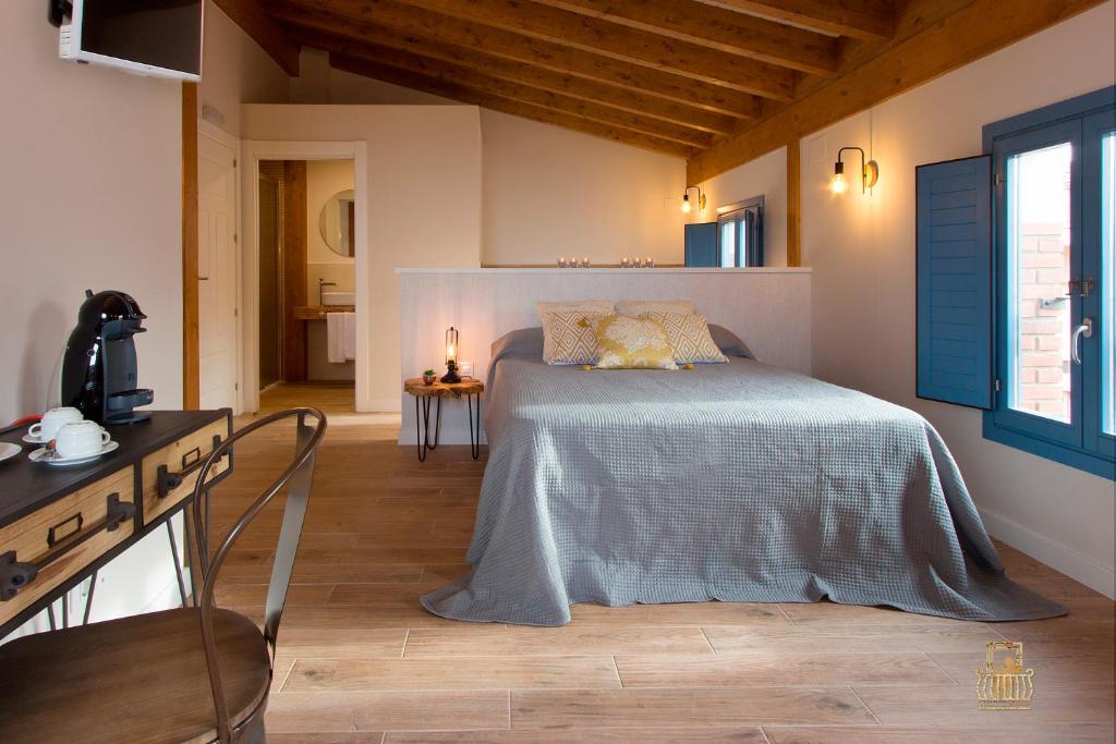A bed or beds in a room at El Mirador de Eloísa
