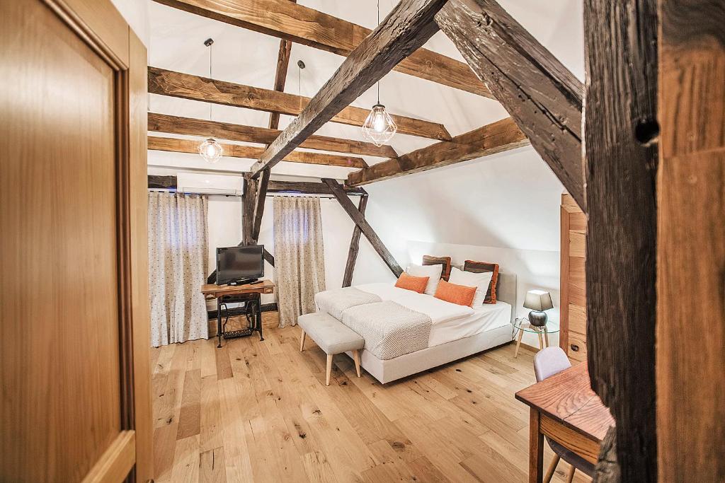 Postel nebo postele na pokoji v ubytování Hotel Pok Garni