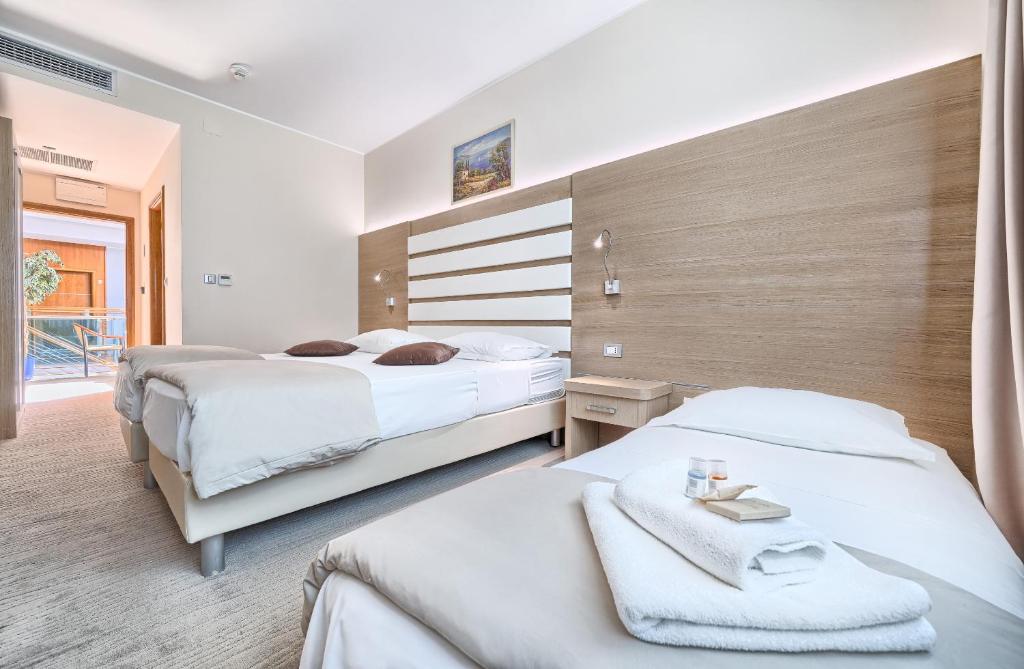 Postel nebo postele na pokoji v ubytování Hotel Panorama