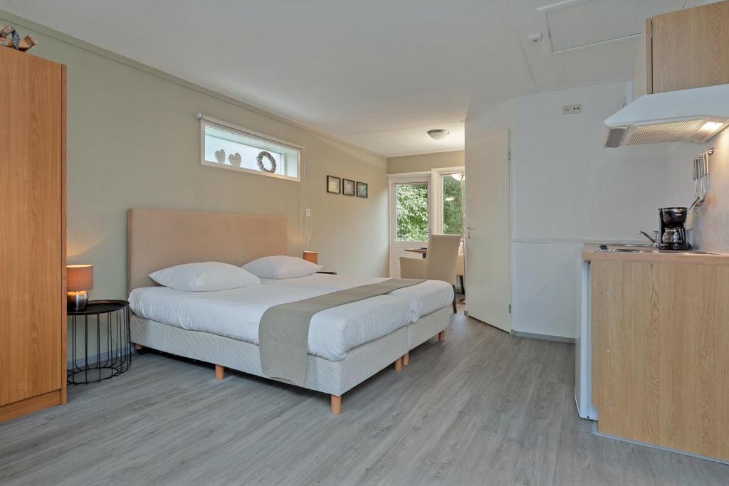 Postel nebo postele na pokoji v ubytování Hotel Randduin