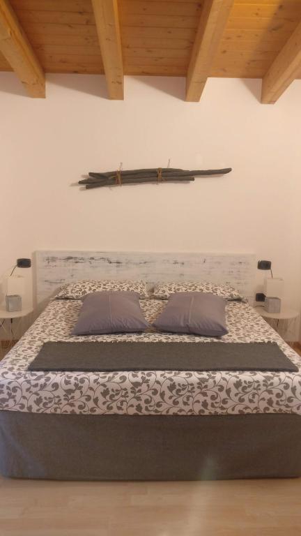 Postel nebo postele na pokoji v ubytování Garnì Al Laghet