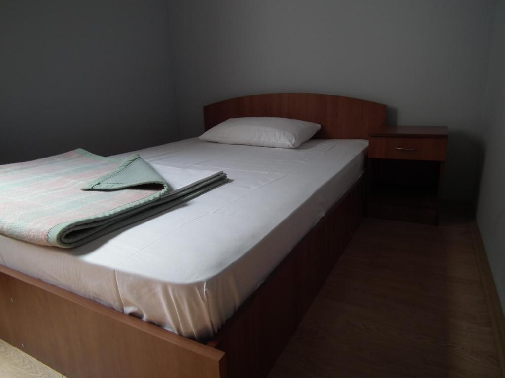 Postel nebo postele na pokoji v ubytování Naša Tvrđava Guest Accommodation