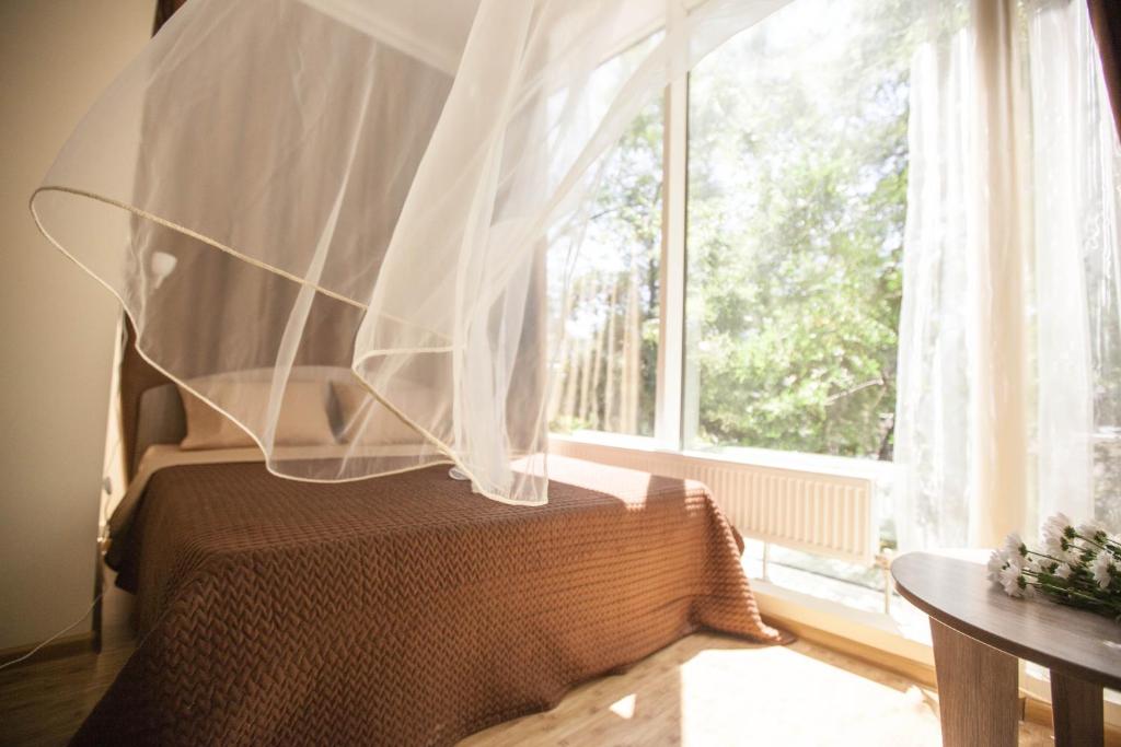 Postel nebo postele na pokoji v ubytování Arnautskiy Hotel