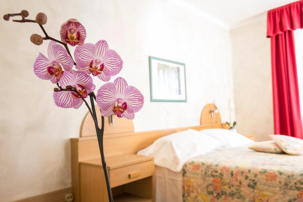 Postel nebo postele na pokoji v ubytování Hotel Centro