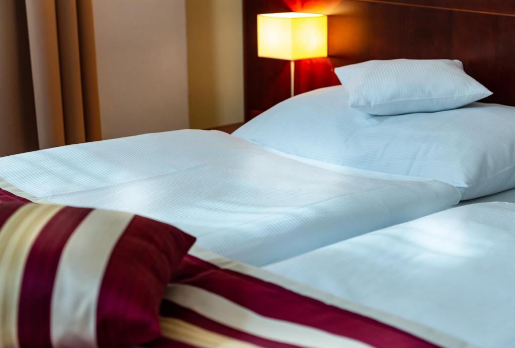Łóżko lub łóżka w pokoju w obiekcie Hotel Petr