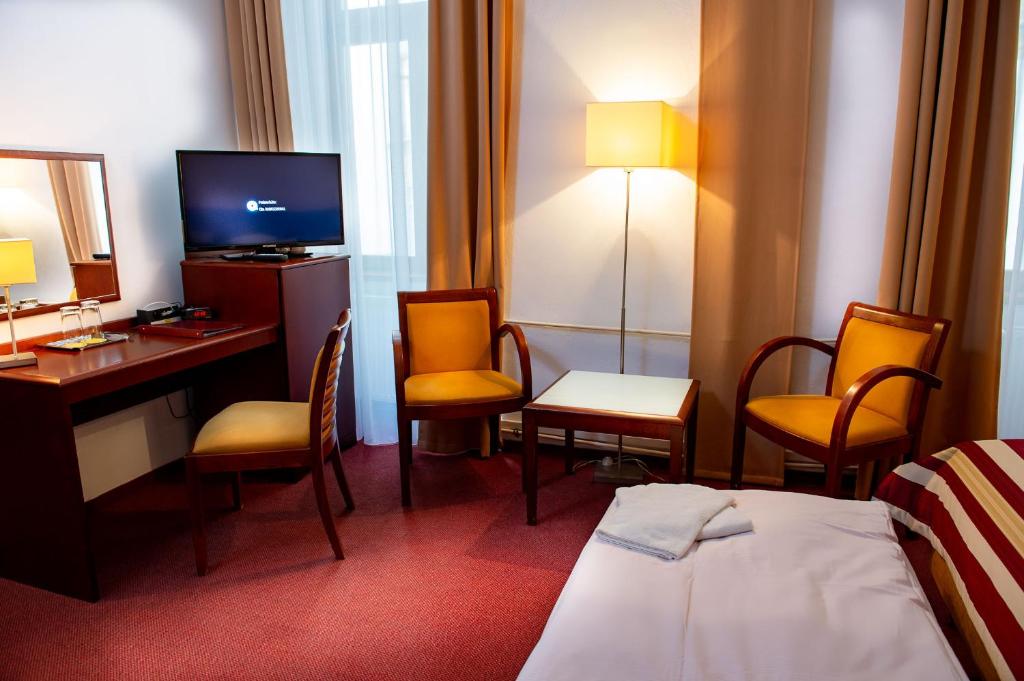 Łóżko lub łóżka w pokoju w obiekcie Hotel Petr